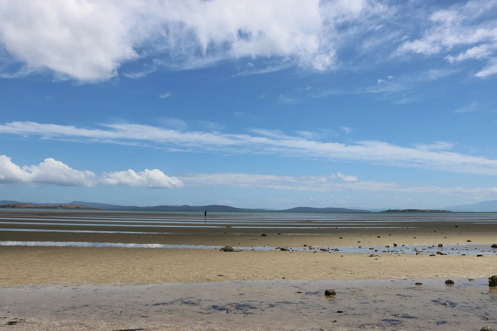 Quiet beach and low coastline near Dunalley