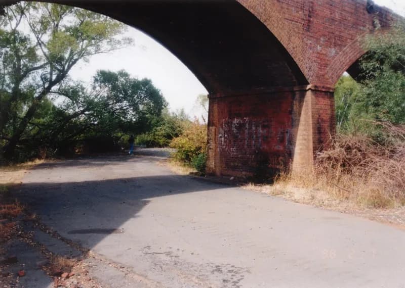 Railway viaduct and open land near Longford