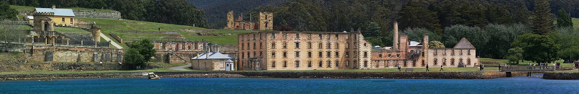 Wide view over the ruins, lawns and harbour at Port Arthur Historic Site