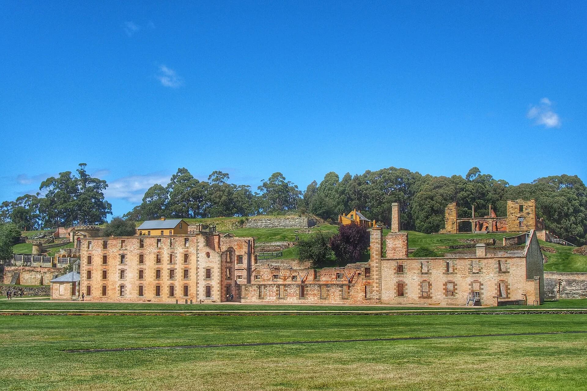 Tall sandstone walls and window openings of the Port Arthur Penitentiary