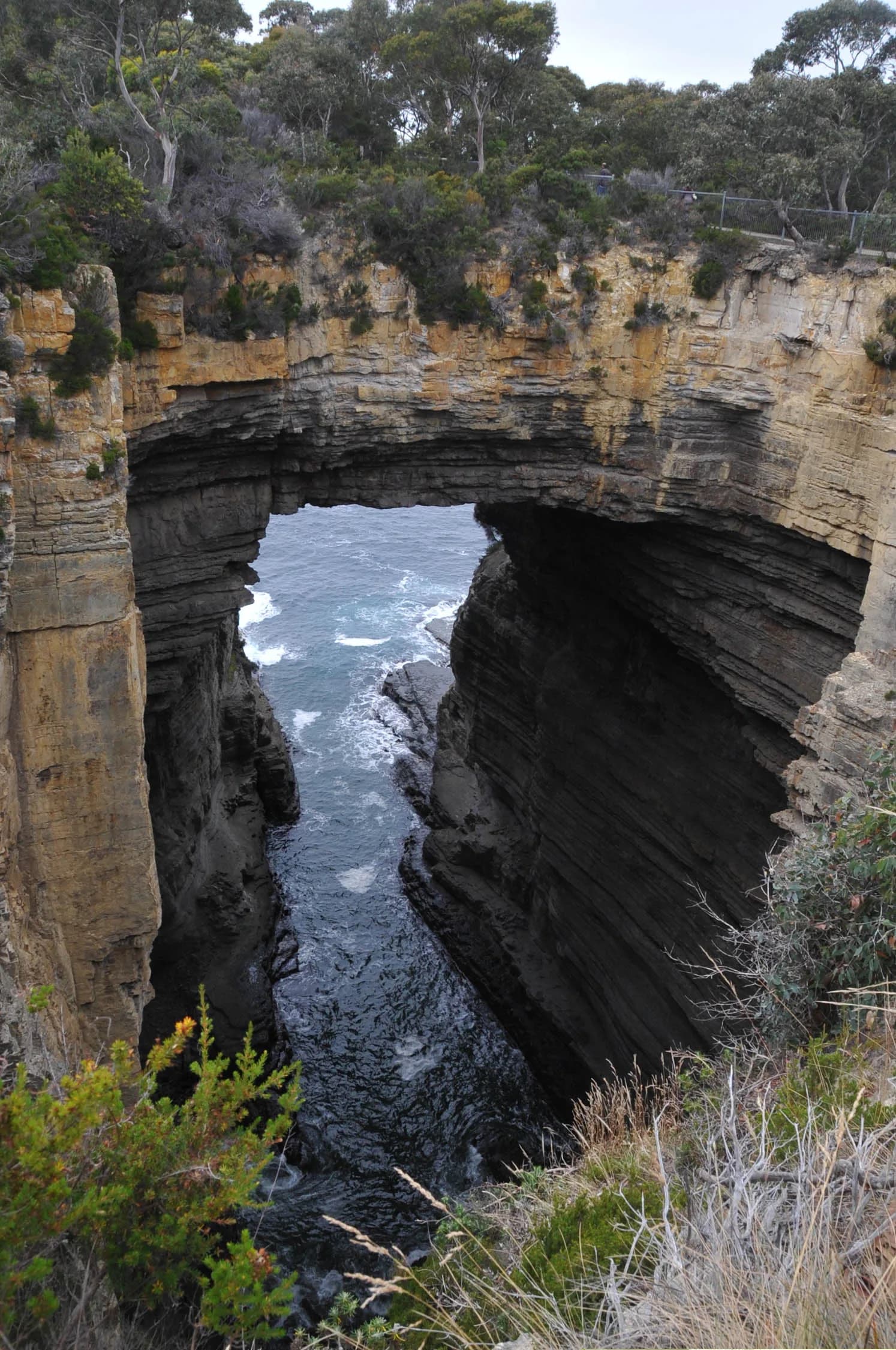 Tasmans Arch cut through coastal rock on the Tasman Peninsula